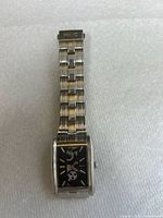 Front view of Relic women's wristwatch showing rectangular black dial with silver markers and multi-link stainless steel bracelet.