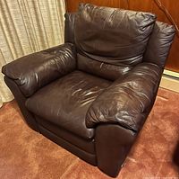 Front angled view showing full chair and leather condition