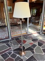 Full view of metal floor lamp with shade