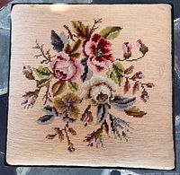 Top view showing floral needlepoint upholstery