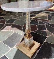 Full view of table showing marble top and pedestal