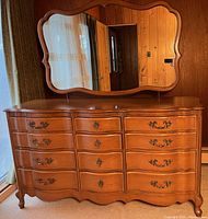 Front view of walnut dresser with matching mirror attached