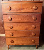 full front view showing five drawers and knobs
