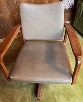 Front view of wooden swivel desk chair