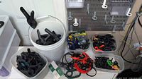 Overview of bucket and bins filled with assorted clamps