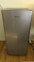 Front view of Hisense silver mini fridge