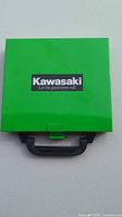 Closed green Kawasaki metal case front view