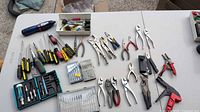 Overview of all hand tools and accessories spread on tables