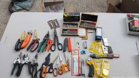 All cutting tools and accessories laid out on table