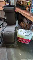 Lounge chair and Igloo wheeled cooler side by side