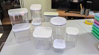 All nine OXO POP containers assembled showing various sizes and lids