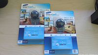 Front view of two sealed Samsung SmartCam HD Plus camera packages