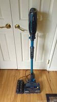 Full view of assembled cordless vacuum and accessories