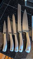 Five Wüsthof Culinar stainless handle knives