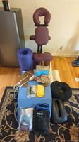 Full lot showing massage chair, foam supports, mat and small therapy items