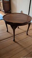 Full view of round wood accent table