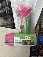 Two rolled Gaiam yoga mat towels in packaging