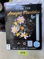 Front cover of Picture Etch Amazing Mandalas book with stylus visible