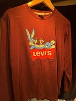 Front view of maroon Levi's Bugs Bunny long-sleeve T-shirt on hanger
