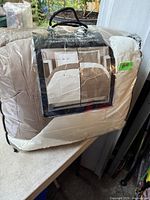 Sealed comforter package showing product image and color