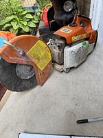 Left side view showing blade guard, abrasive disc, and body