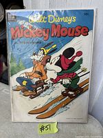 Front cover of Walt Disney Mickey Mouse comic showing characters skiing
