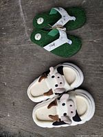 Both pairs of sandals laid out on surface