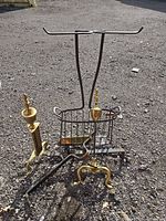 group shot showing log holder, pair of andirons, tool stand, single fire iron