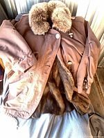 Brown fur-lined coat showing exterior, fur collar and lining