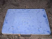 Closed blue Coleman hard-shell case top view