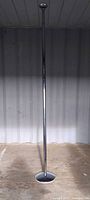 Stripper pole fully assembled standing between floor and ceiling