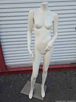 Front view full-body mannequin on metal base