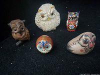 All five owl figurines displayed