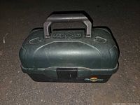 Closed Flambeau tackle box showing exterior condition, handle and logo