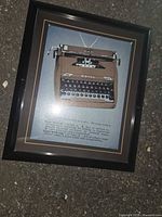 Full view of framed typewriter print