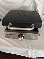 Griddle closed with hood down, front view