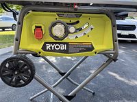 Front view of Ryobi control panel showing brand logo, bevel lock lever and power switch