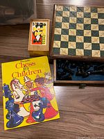 Chessboard, boxed chess set, book overview
