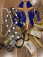 Group shot of all necklaces, brooches and earrings