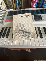 Manual cover displaying Hohner PSK75 title and keyboard image