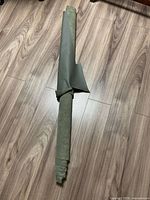 Full rolled faux leather remnant on floor