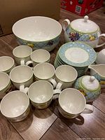 Group view of Mikasa dinnerware set: cups, saucers, large bowl, lidded tureen