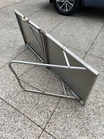 table folded with legs visible underneath