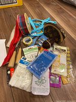 Overview of assorted ribbons, coin pouch, tape, cord, buttons and other notions