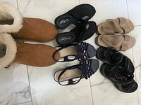 All five footwear pairs laid out