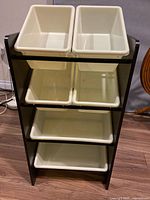 Front view of cabinet showing frame and six bins