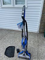 Full view of Bissell CrossWave Premier cleaner standing upright with tray