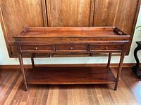 Front view showing drawers and lower shelf