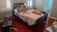 Full bed frame with mattress and box spring in room setting