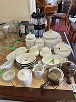 Group shot of all whiteware and brown soup bowls on table